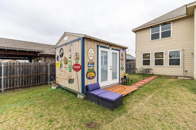 view of outbuilding featuring a yard