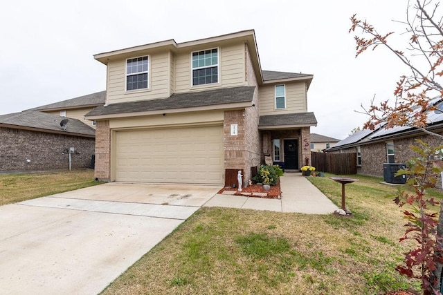 view of front of property with central AC unit, a front yard, and a garage