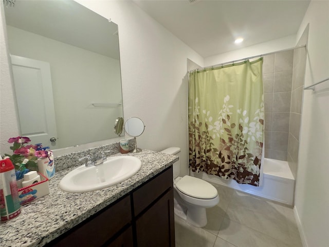 full bathroom with vanity, shower / tub combo with curtain, tile patterned floors, and toilet