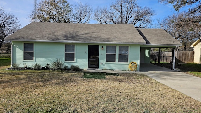 ranch-style home with a front yard and a carport