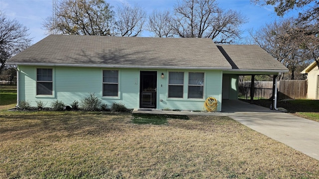 ranch-style home with a front lawn and a carport