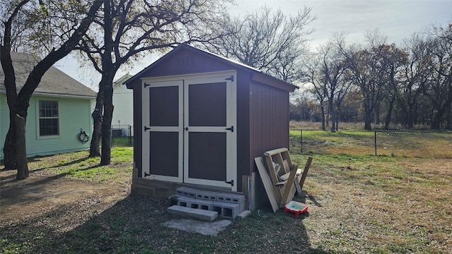 view of outbuilding with a yard