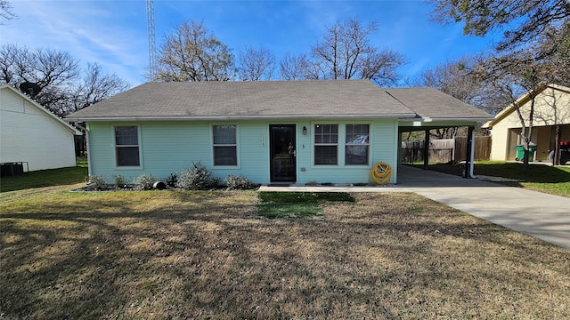 view of front facade with a front lawn and a carport