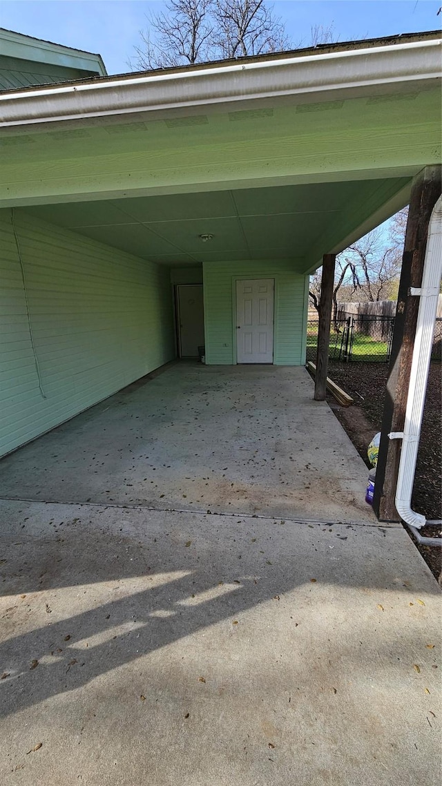 view of vehicle parking with a carport