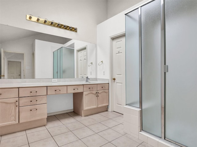 bathroom featuring tile patterned floors, vanity, and an enclosed shower