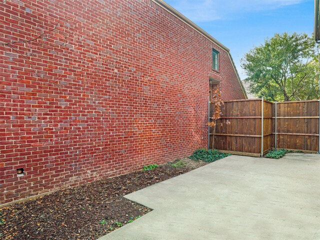 view of side of property featuring a patio