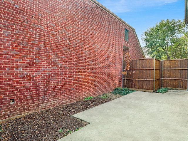 view of side of property featuring a patio area