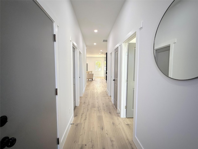 hallway with light wood-type flooring