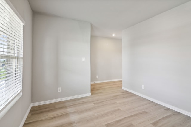 unfurnished room featuring light wood-type flooring