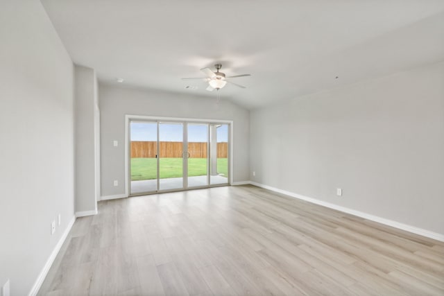 empty room with light hardwood / wood-style flooring, ceiling fan, and lofted ceiling