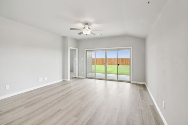 unfurnished room featuring ceiling fan, light wood-type flooring, and vaulted ceiling