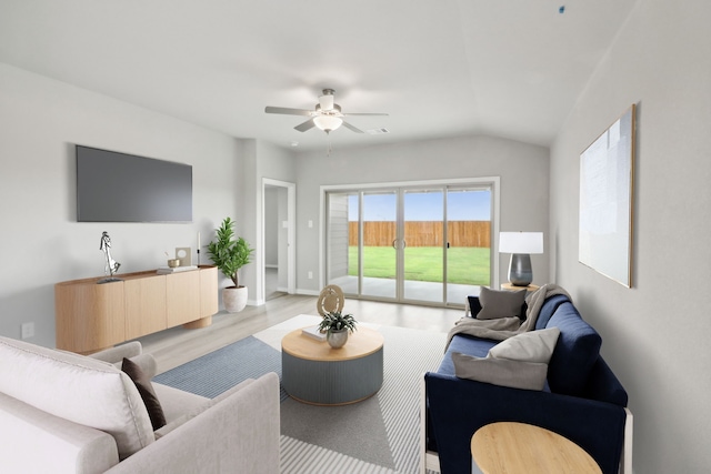 living room with ceiling fan, light hardwood / wood-style floors, and lofted ceiling