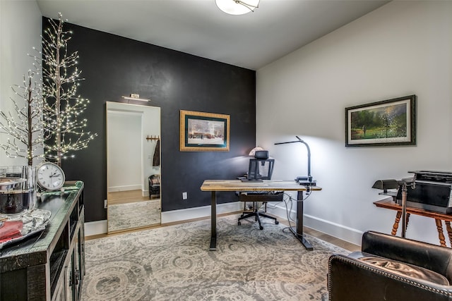 office area with wood finished floors and baseboards