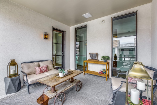 view of patio / terrace featuring a balcony and an outdoor living space