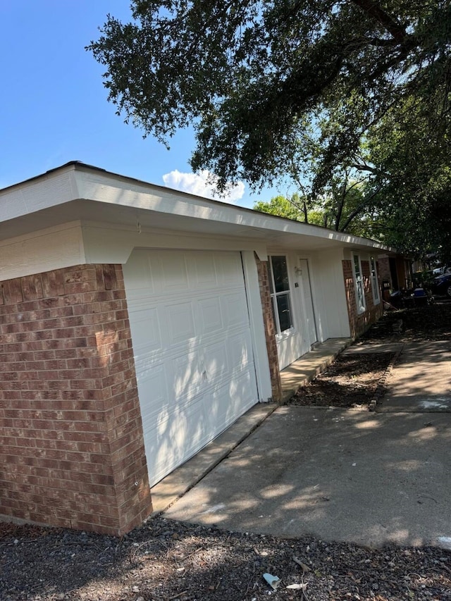 view of side of home with a garage