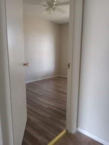 empty room featuring ceiling fan and dark hardwood / wood-style floors