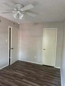 interior space featuring ceiling fan and dark hardwood / wood-style floors