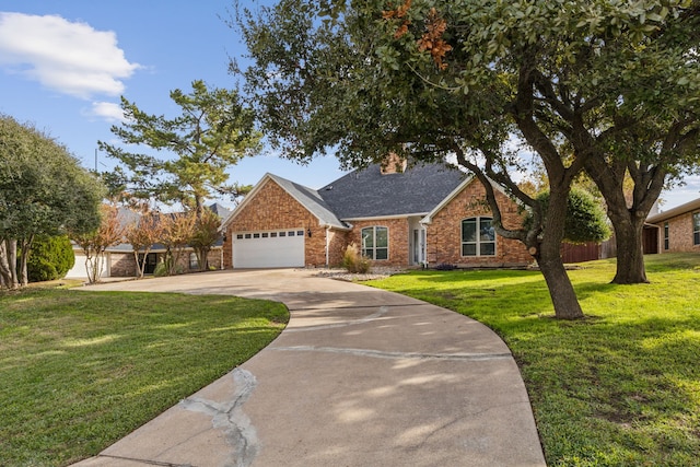 view of front of house with a garage and a front yard