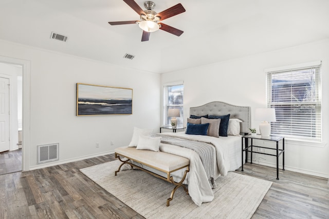 bedroom featuring ceiling fan and hardwood / wood-style flooring