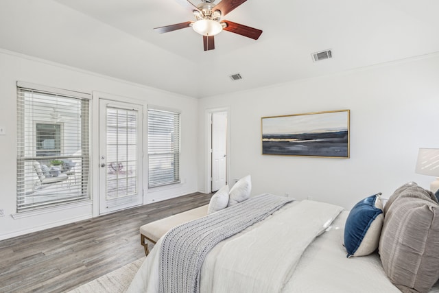 bedroom featuring hardwood / wood-style flooring, ceiling fan, access to exterior, and ornamental molding