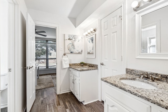 bathroom featuring hardwood / wood-style floors, vanity, and ceiling fan