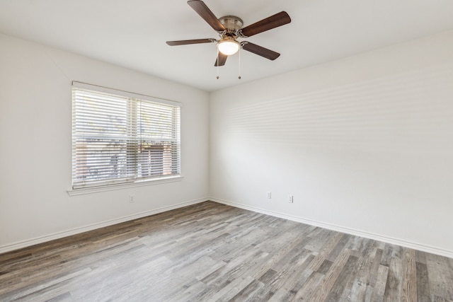 spare room featuring ceiling fan and light hardwood / wood-style floors