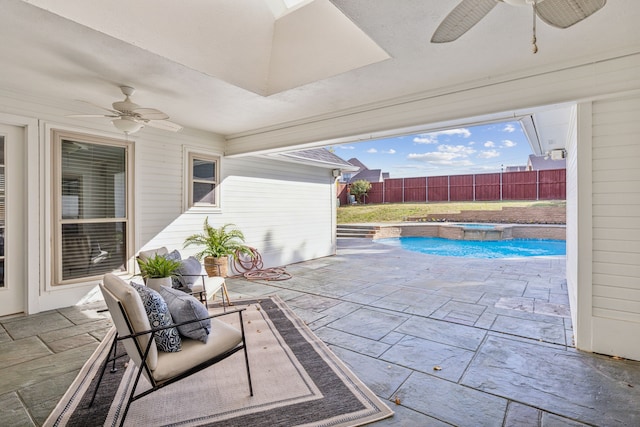 view of patio / terrace featuring a fenced in pool and ceiling fan