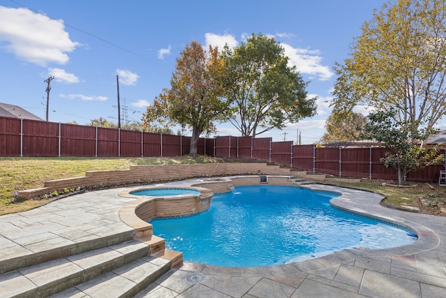 view of swimming pool with a patio area and an in ground hot tub