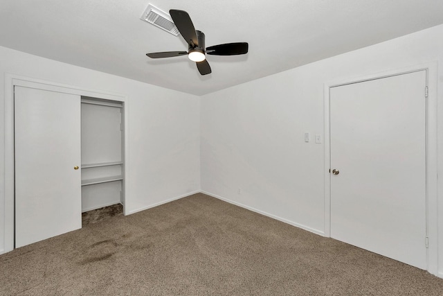 unfurnished bedroom featuring a closet, ceiling fan, and carpet flooring