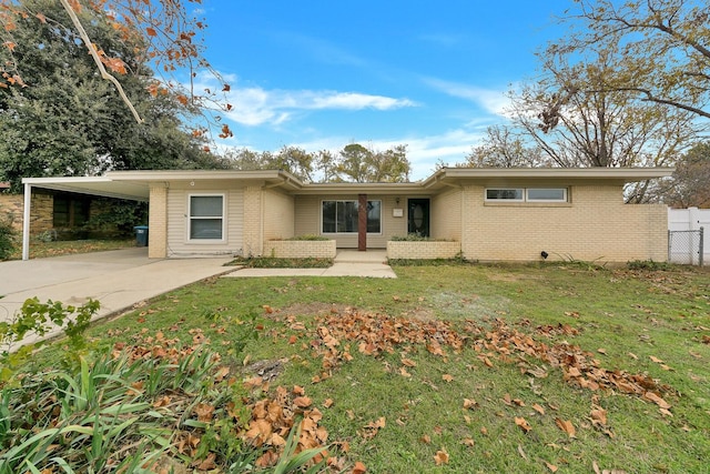 ranch-style house with a carport and a front yard