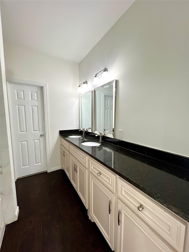 bathroom with hardwood / wood-style floors and vanity