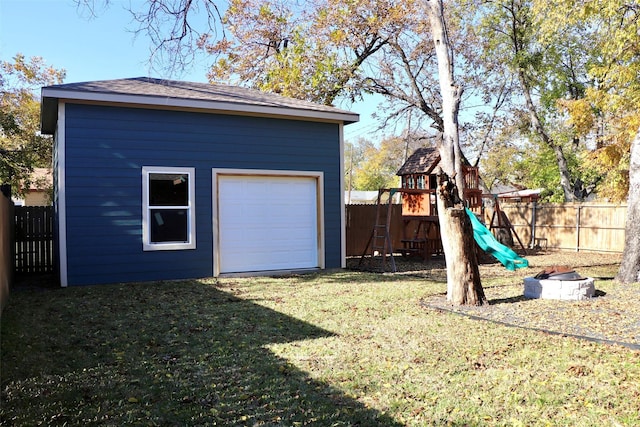 garage featuring a lawn