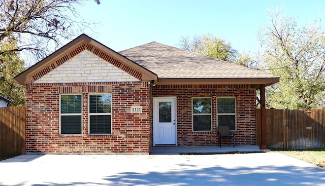 bungalow-style home with a patio area