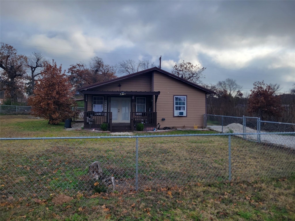 view of front of house with a front lawn and a porch