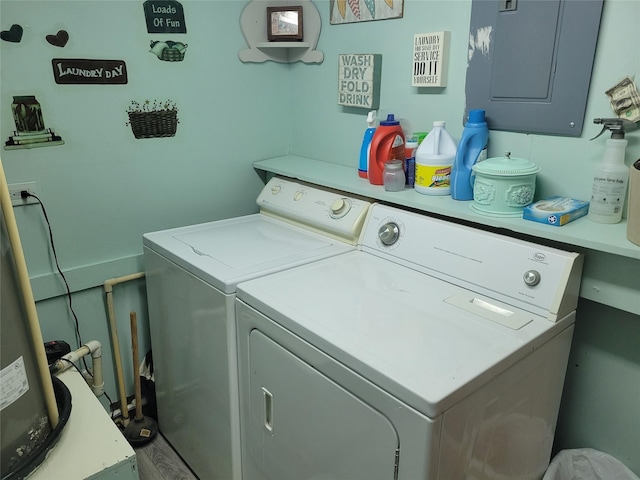 washroom with washer and clothes dryer and electric panel