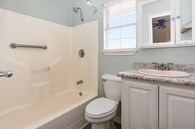 bathroom with bathtub / shower combination, vanity, and toilet