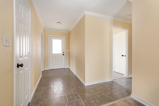 interior space featuring ornamental molding and baseboards