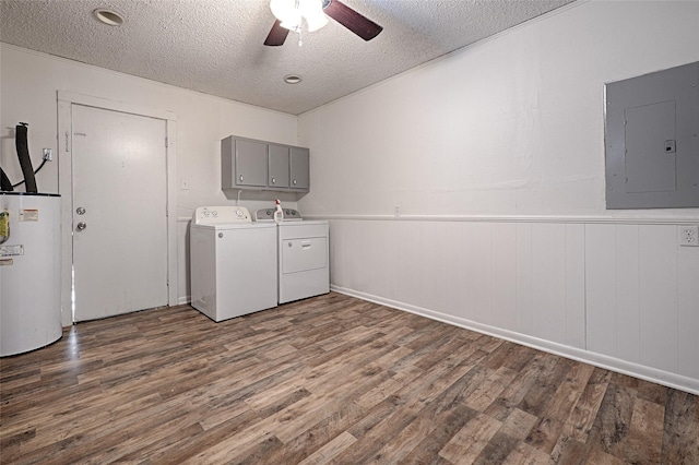 washroom with cabinets, electric panel, washer and dryer, dark hardwood / wood-style floors, and water heater