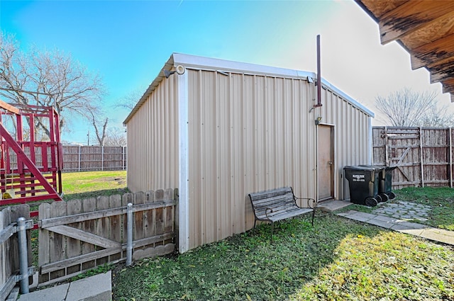 view of outbuilding featuring a yard