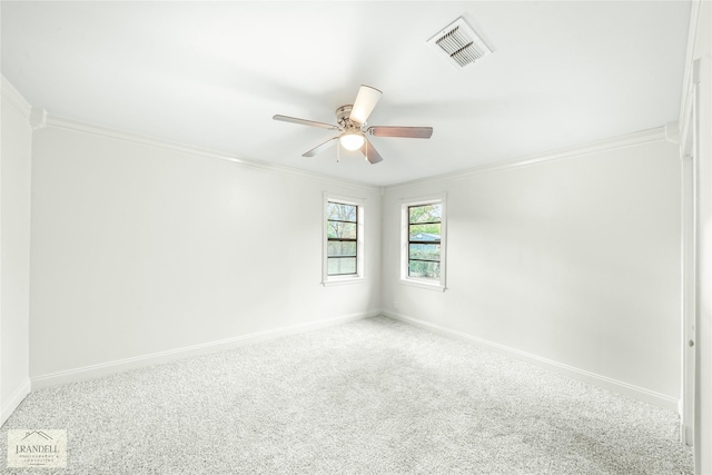 carpeted empty room featuring ceiling fan and ornamental molding