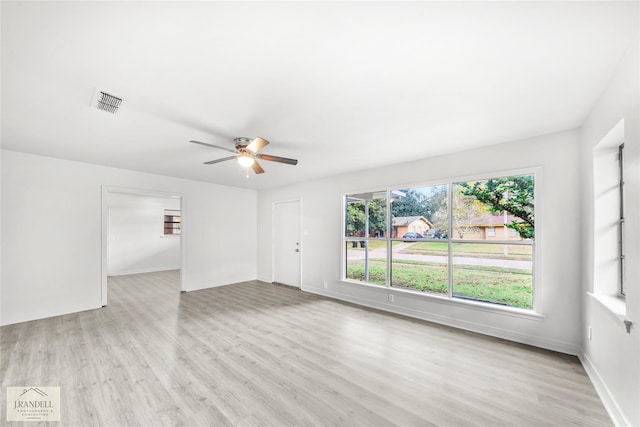 unfurnished room with light hardwood / wood-style flooring and ceiling fan