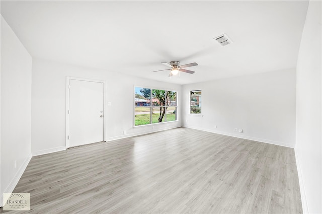 spare room featuring ceiling fan and light hardwood / wood-style floors