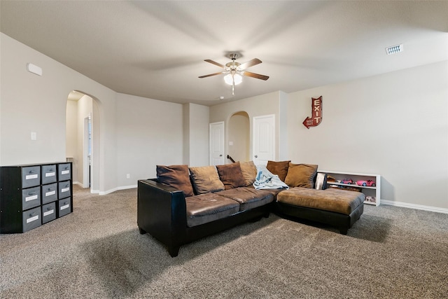 living room featuring ceiling fan and carpet flooring