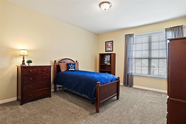 bedroom with light colored carpet