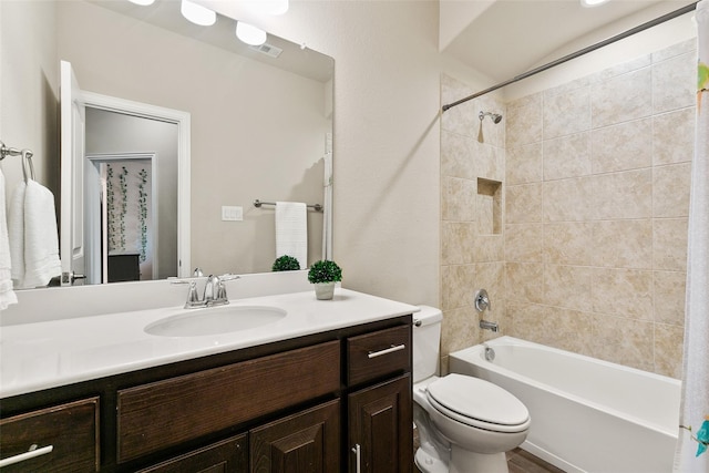 full bathroom featuring toilet, vanity, and shower / bath combo with shower curtain