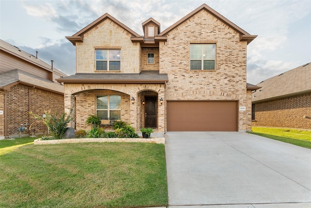 view of front of home featuring a garage and a front lawn