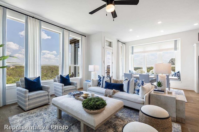 living room with hardwood / wood-style floors and ceiling fan