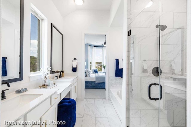 bathroom featuring ceiling fan, shower with separate bathtub, vanity, and vaulted ceiling