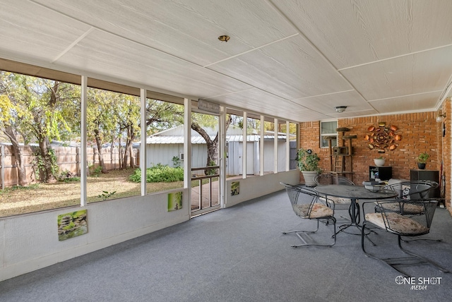 unfurnished sunroom with a wealth of natural light