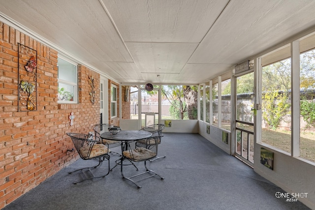 sunroom featuring a healthy amount of sunlight